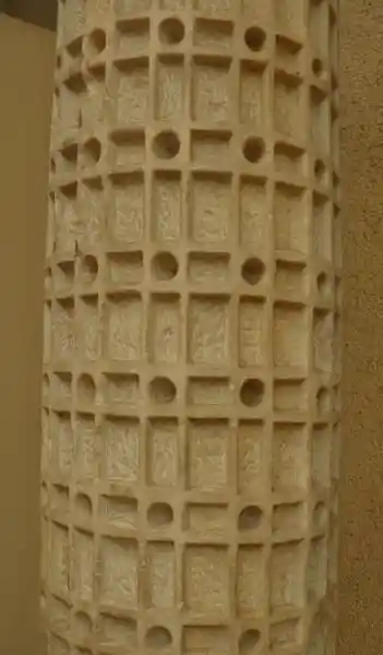 Geometrically derived cross of squares and circles engraved on a marble column Geometrically derived cross of squares and circles engraved on a marble column